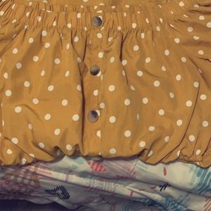 Yellow romper with white polkadots